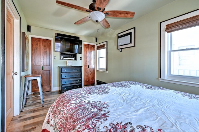 bedroom featuring ceiling fan and light wood-type flooring