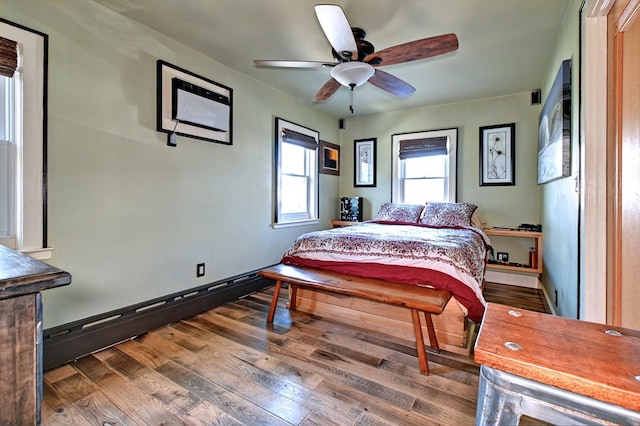 bedroom featuring hardwood / wood-style flooring and ceiling fan