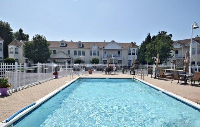 view of swimming pool with a patio area