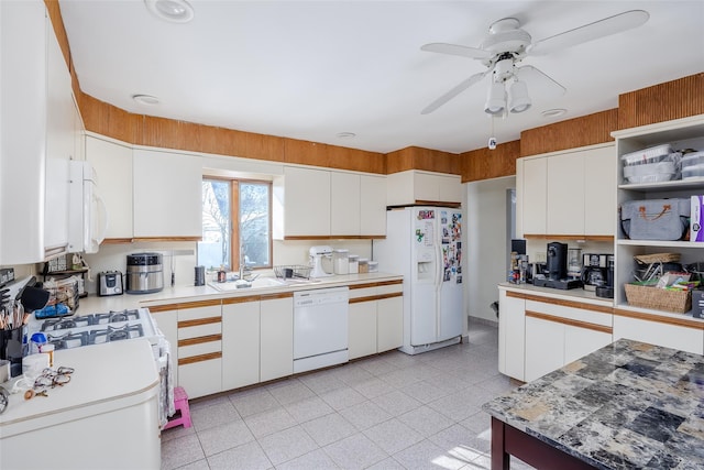 kitchen with white cabinetry, white appliances, ceiling fan, and sink