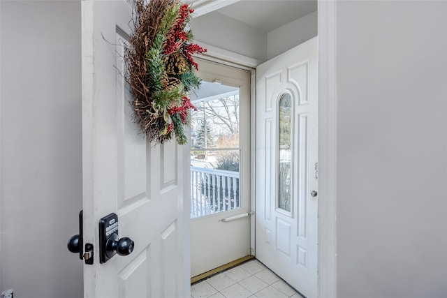 entryway with light tile patterned floors