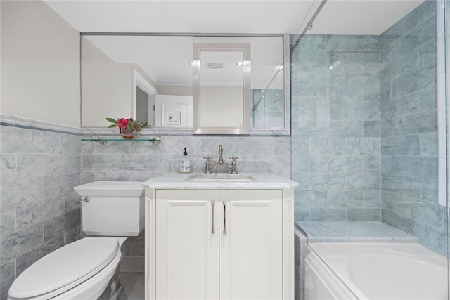 bathroom with vanity, tile walls, and toilet