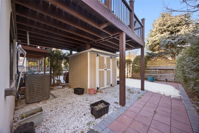 view of patio with a storage shed