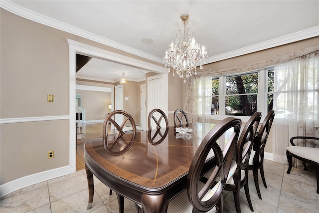 dining space with an inviting chandelier and ornamental molding