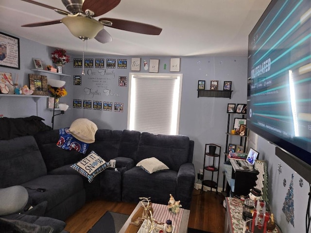 living room featuring wood-type flooring and ceiling fan