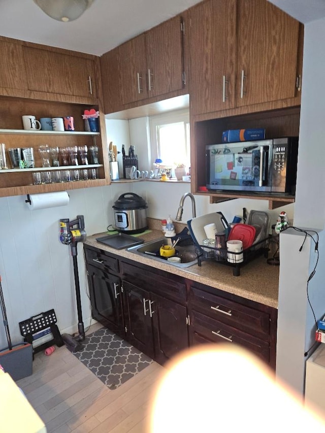 kitchen with sink and dark hardwood / wood-style floors