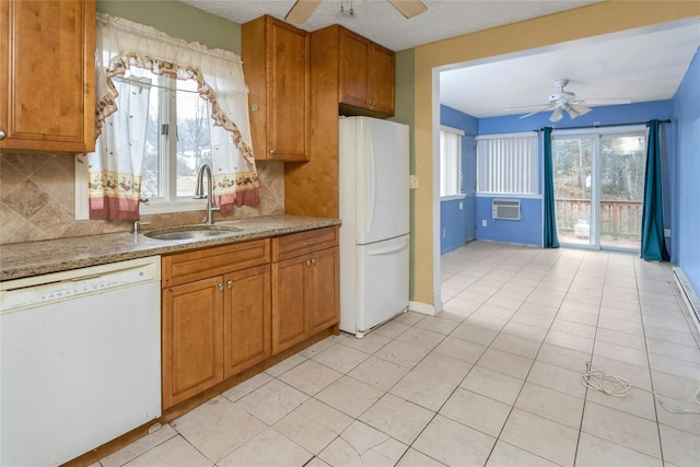 kitchen with ceiling fan, white appliances, sink, and backsplash