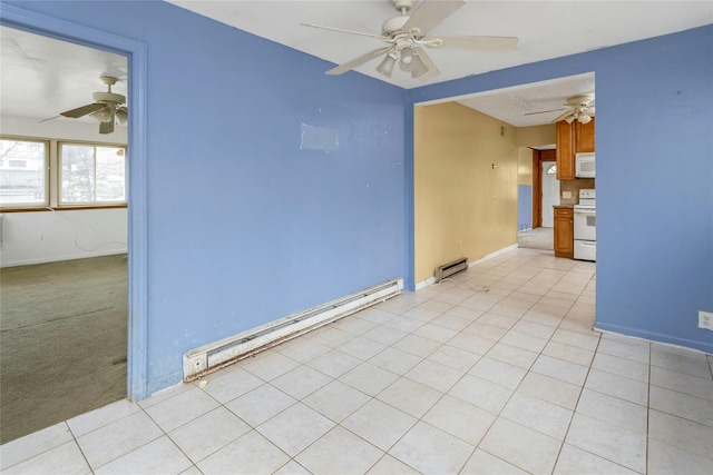 tiled spare room with baseboard heating