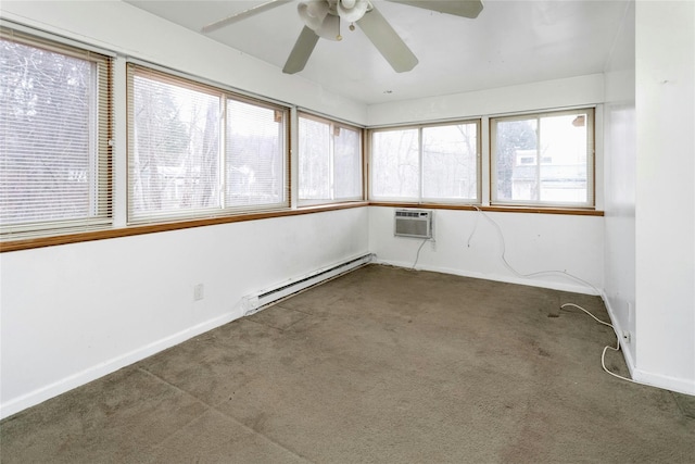 unfurnished sunroom featuring baseboard heating, ceiling fan, and a wall mounted air conditioner