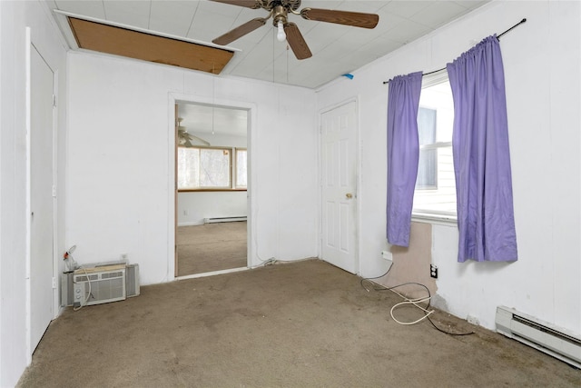 unfurnished bedroom with ceiling fan, carpet floors, a wall mounted AC, and baseboard heating