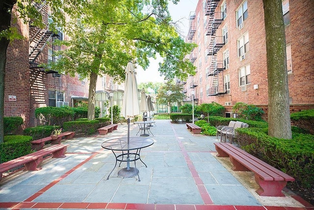 view of property's community featuring a patio area