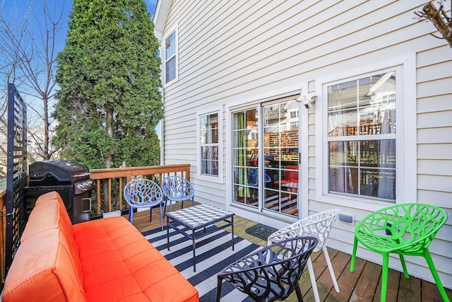 deck with area for grilling and an outdoor hangout area