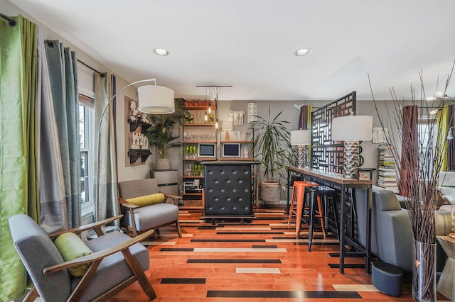 living area with hardwood / wood-style flooring