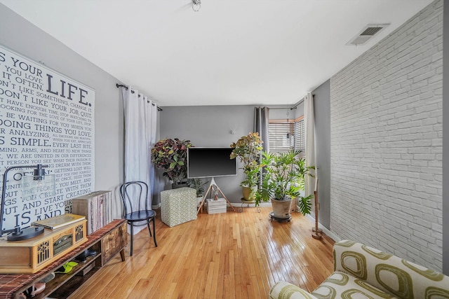 sitting room featuring hardwood / wood-style flooring