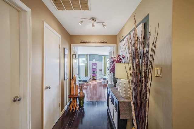 corridor featuring dark hardwood / wood-style floors