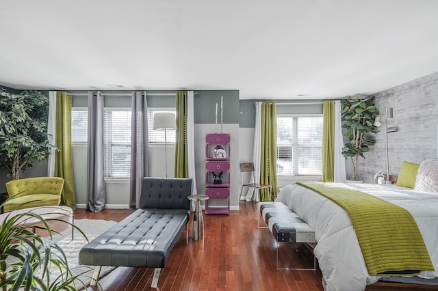 bedroom with dark hardwood / wood-style floors