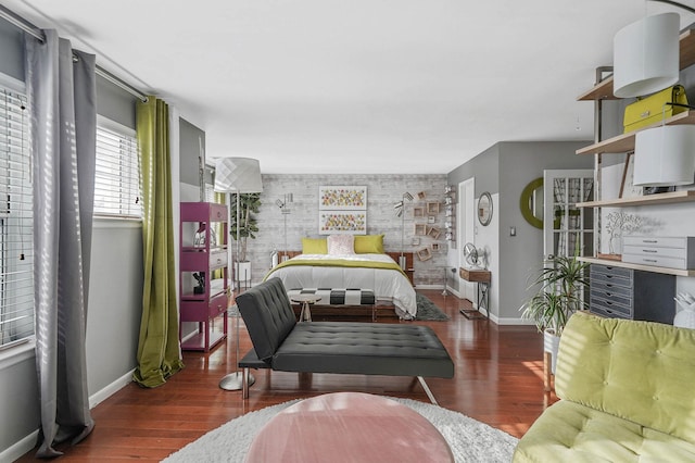 bedroom with dark hardwood / wood-style flooring