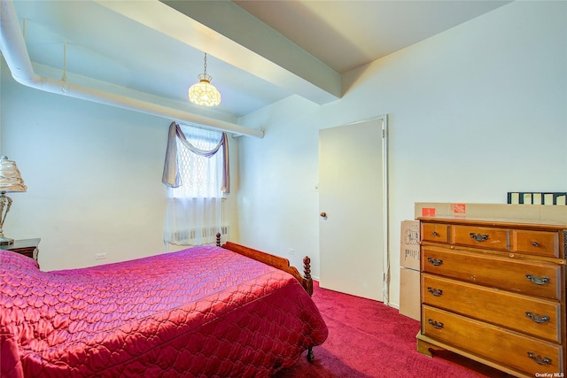 bedroom featuring beam ceiling and carpet floors