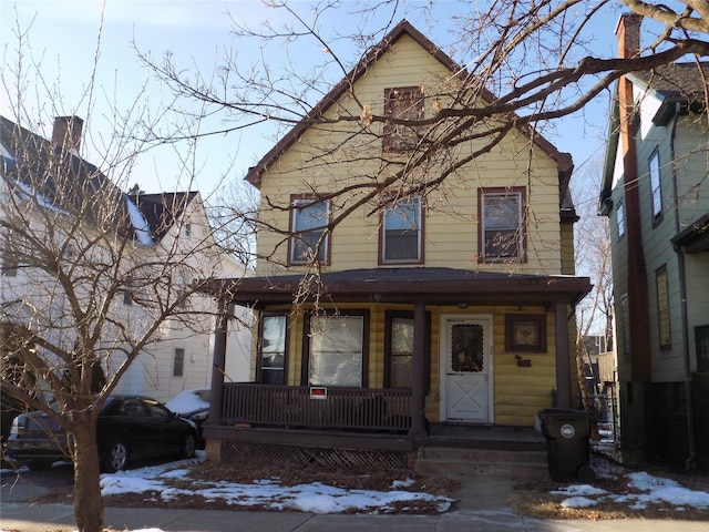 view of property featuring covered porch