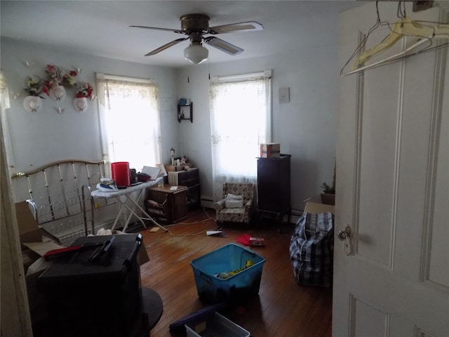 miscellaneous room with a wealth of natural light, dark hardwood / wood-style floors, and ceiling fan