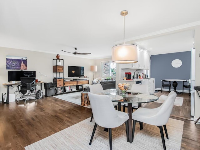 dining space with hardwood / wood-style floors and ceiling fan