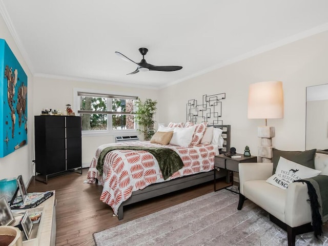 bedroom featuring wood-type flooring, ornamental molding, and ceiling fan