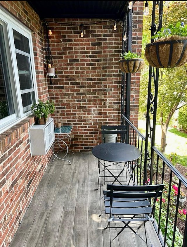 balcony featuring an AC wall unit