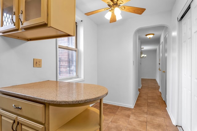 kitchen with light tile patterned floors and ceiling fan