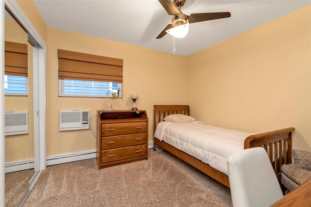 bedroom with an AC wall unit, ceiling fan, and carpet