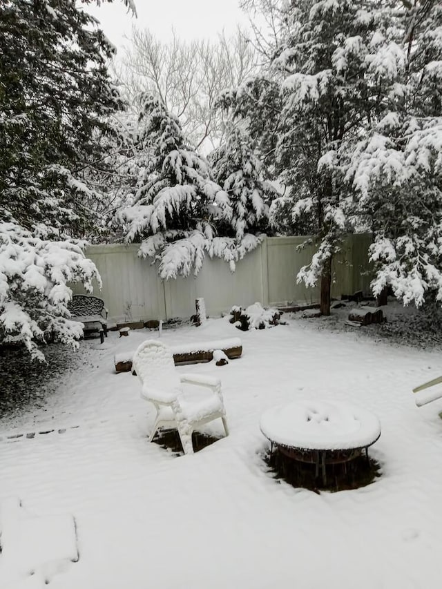 view of yard layered in snow