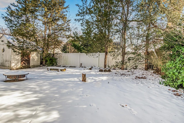 view of yard covered in snow