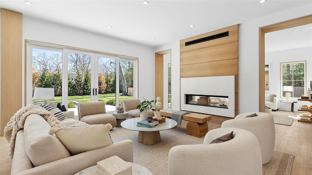 living room with french doors and light hardwood / wood-style flooring