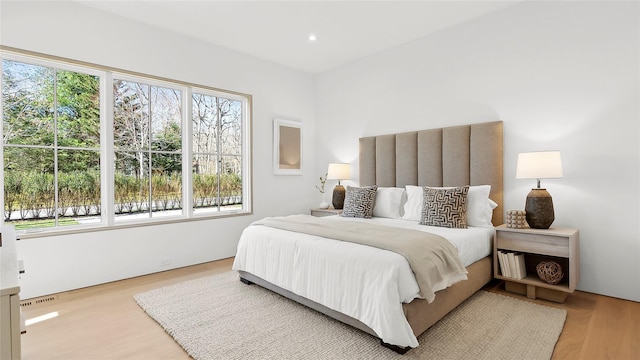 bedroom featuring light wood-type flooring