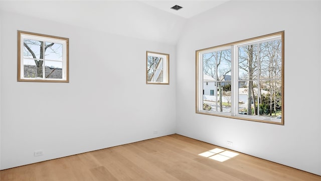 spare room featuring light hardwood / wood-style floors