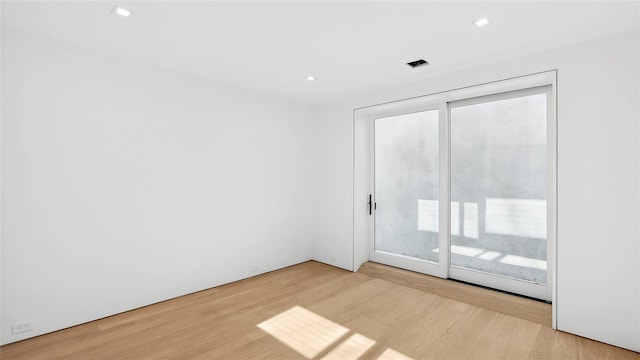 unfurnished room featuring light wood-type flooring