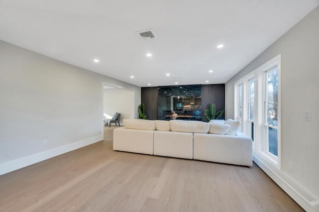 unfurnished living room featuring light wood-type flooring