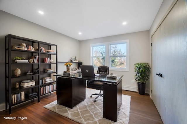 office space with wood-type flooring