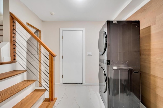 washroom with stacked washer and dryer