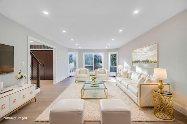 living room with light hardwood / wood-style flooring