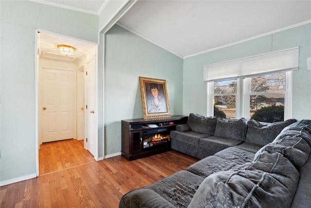 living room with crown molding, lofted ceiling, and wood-type flooring