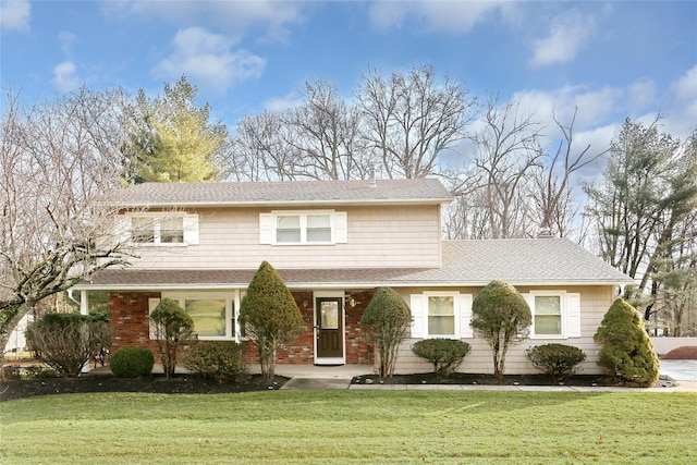 front facade with a front lawn