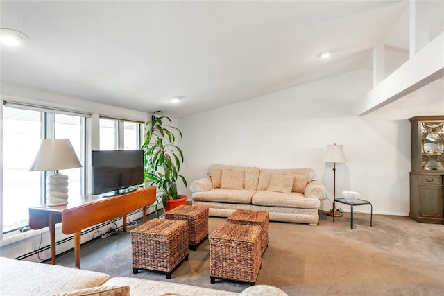 carpeted living room featuring a baseboard radiator and vaulted ceiling