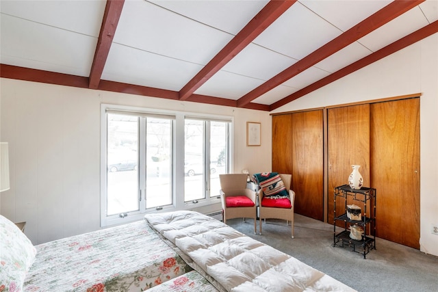 carpeted bedroom featuring lofted ceiling with beams