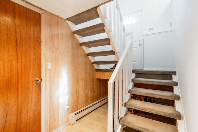 staircase with a baseboard radiator