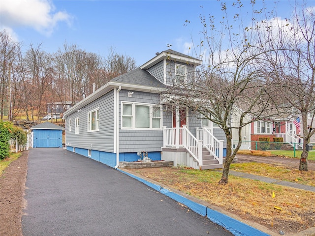 view of front of house featuring a shed