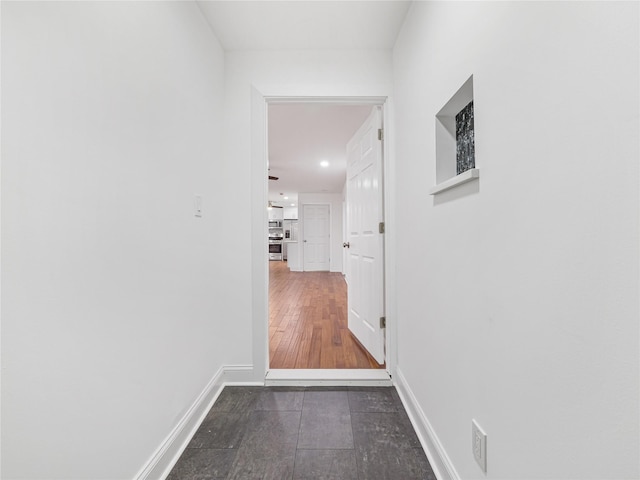 hall featuring dark wood-type flooring