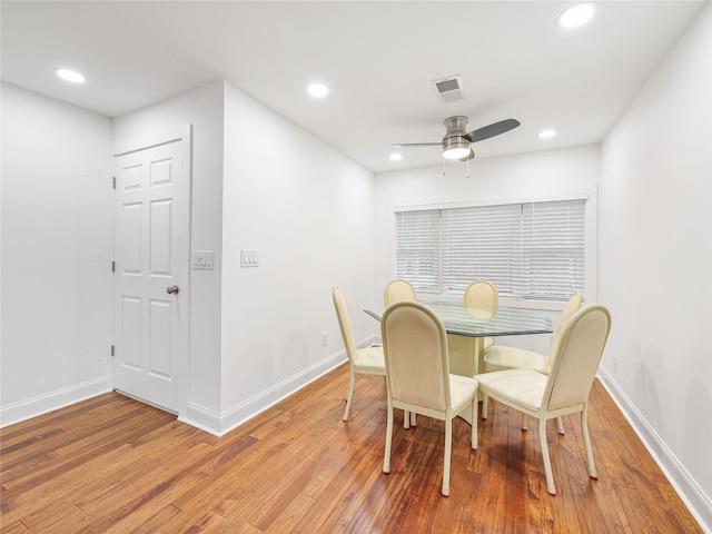 dining room featuring hardwood / wood-style floors and ceiling fan