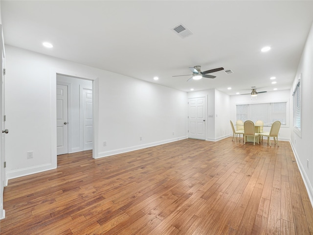 interior space featuring hardwood / wood-style floors and ceiling fan