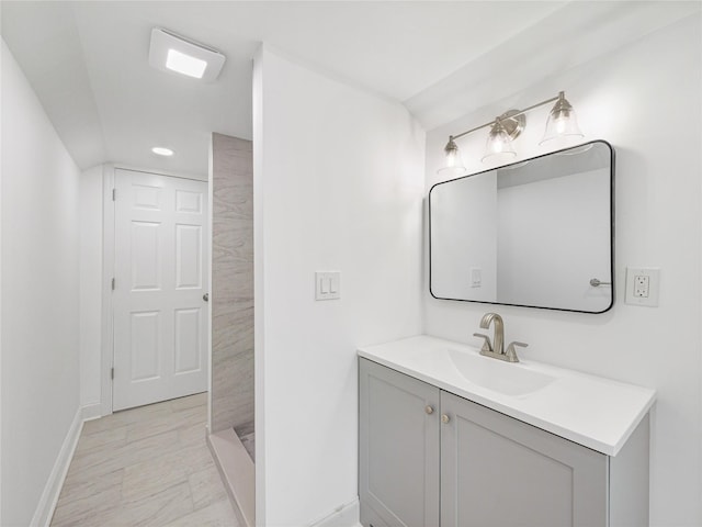 bathroom featuring vanity and a shower