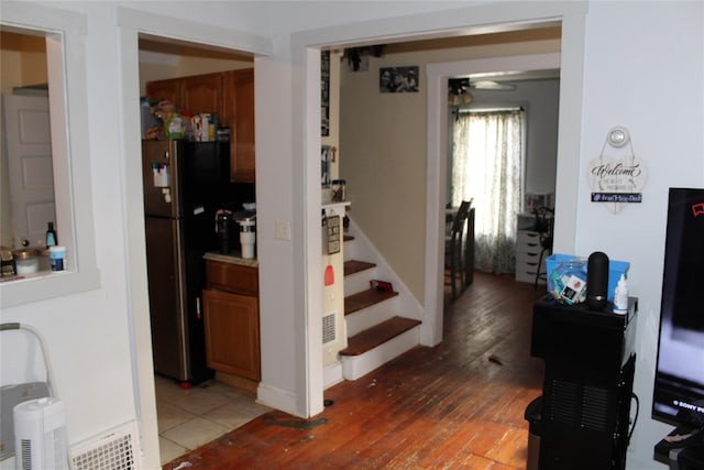 stairs with hardwood / wood-style floors